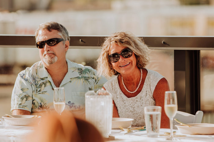 a man and a woman wearing sunglasses at the reception